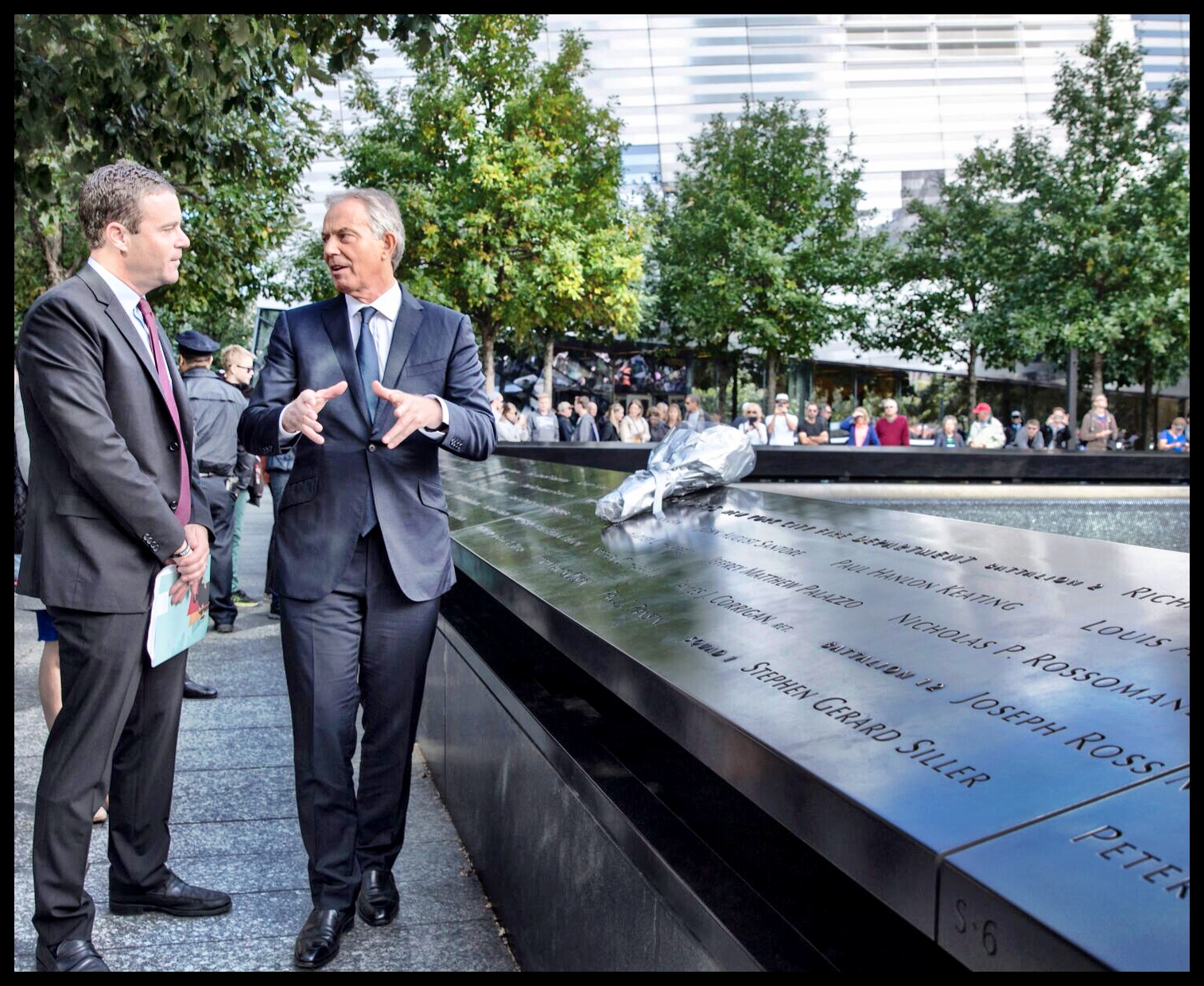 Joe Daniels in conversation beside the Memorial reflecting pool